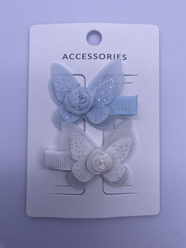 Des pinces à cheveux de papillons et de fleurs en 2 paquets bleu et blanc avec fixation élastique